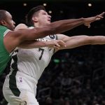 
              Milwaukee Bucks guard Grayson Allen (7) drives to the basket past Boston Celtics center Al Horford (42) during the first half of an NBA basketball game, Monday, Dec. 13, 2021, in Boston. (AP Photo/Charles Krupa)
            