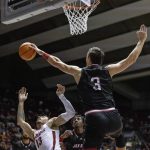 
              Jacksonville State center Maros Zeliznak (3) blocks a shot from Alabama guard Jahvon Quinerly (13) during the first half of an NCAA college basketball game, Saturday, Dec. 18, 2021, in Tuscaloosa, Ala. (AP Photo/Vasha Hunt)
            