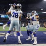 
              Dallas Cowboys offensive tackle Terence Steele (78) celebrates with Connor McGovern (66) and others after catching a touchdown pass in the first half of an NFL football game against the Washington Football Team in Arlington, Texas, Sunday, Dec. 26, 2021. (AP Photo/Michael Ainsworth)
            