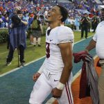 
              FILE - Alabama quarterback Bryce Young celebrates in front of fans as he leaves the field after Alabama defeated Florida in an NCAA college football game Sept. 18, 2021, in Gainesville, Fla. Young has been voted The Associated Press college football player of the year. (AP Photo/John Raoux, File)
            