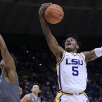 
              LSU forward Mwani Wilkinson (5) grabs a rebound during the first half of the team's NCAA college basketball game against Lipscomb in Baton Rouge, La., Wednesday, Dec. 22, 2021. (AP Photo/Matthew Hinton)
            