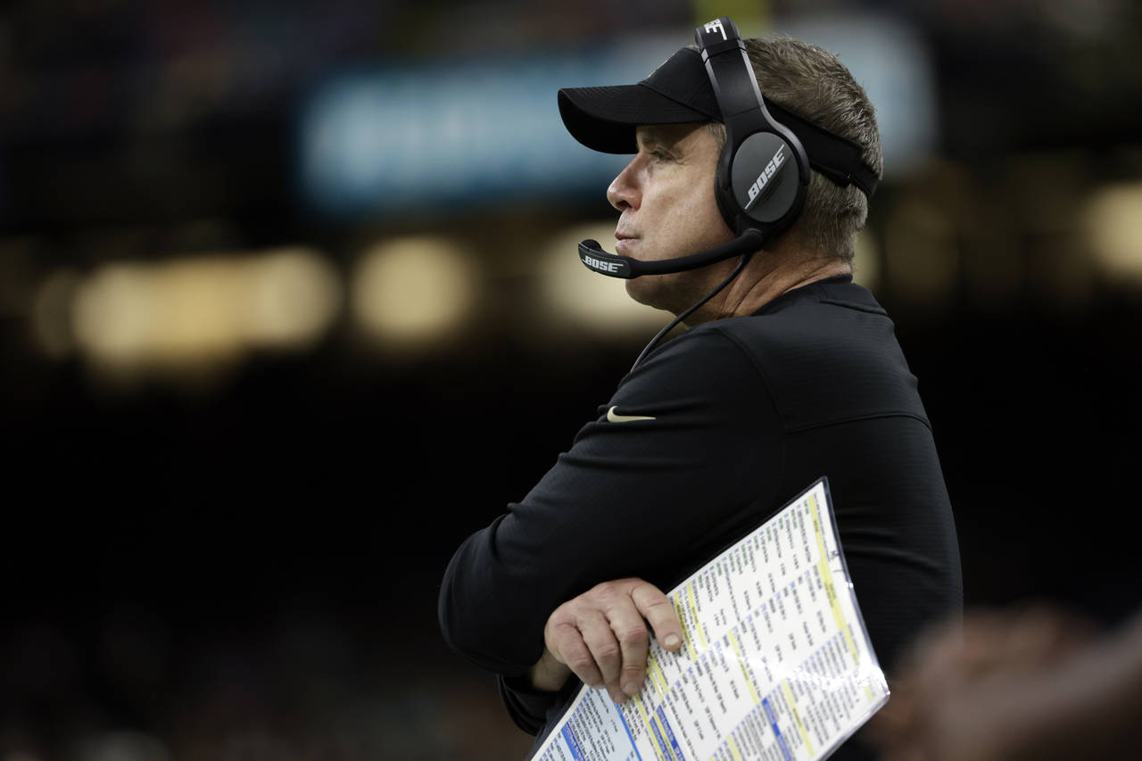 New Orleans Saints coach Sean Payton watches from the sideline during the second half of an NFL foo...