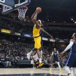 
              Indiana Pacers' Myles Turner (33) goes up for a dunk during the second half of an NBA basketball game against the Dallas Mavericks, Friday, Dec. 10, 2021, in Indianapolis. (AP Photo/Darron Cummings)
            