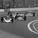 
              FILE - Al Unser in his Parnelli /VPJ (21) passes Tom Sneva's McLaren/Cosworth (8) in first turn of first lap on Sunday, May 29, 1977 in Indianapolis 500-mile race. Unser, one of only four drivers to win the Indianapolis 500 a record four times, died Thursday, Dec. 9, 2021, following years of health issues. He was 82. (AP Photo, File)
            