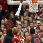 
              Ohio State forward E.J. Liddell, left, goes up for a shot in front of Wisconsin forward Steven Crowl, center, and Ohio State forward Zed Key during the first half of an NCAA college basketball game in Columbus, Ohio, Saturday, Dec. 11, 2021. (AP Photo/Paul Vernon)
            