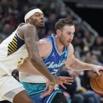 
              Charlotte Hornets' Gordon Hayward (20) is defended by Indiana Pacers' Torrey Craig (13) during the first half of an NBA basketball game, Wednesday, Dec. 29, 2021, in Indianapolis. (AP Photo/Darron Cummings)
            
