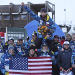 
              United States' Bryce Bennett celebrates with teammates after winning an alpine ski, men's World Cup downhill race, in Val Gardena, Italy, Saturday, Dec.18, 2021. (AP Photo/Alessandro Trovati)
            