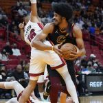 
              Cleveland Cavaliers center Jarrett Allen, right, looks for an open teammate past Miami Heat forward Caleb Martin (16) during the first half of an NBA basketball game, Wednesday, Dec. 1, 2021, in Miami. (AP Photo/Wilfredo Lee)
            