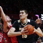 
              Purdue center Zach Edey (15) goes to the basket against Rutgers forward Dean Reiber during the first half of an NCAA college basketball game in Piscataway, N.J., Thursday, Dec. 9, 2021. (AP Photo/Noah K. Murray)
            
