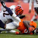 
              Denver Broncos quarterback Teddy Bridgewater (5) is hit by Cincinnati Bengals defensive end B.J. Hill during the second half of an NFL football game, Sunday, Dec. 19, 2021, in Denver. Bridgwater left the game after being injured on the play. (AP Photo/Jack Dempsey)
            