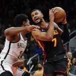 
              Atlanta Hawks guard Timothe Luwawu-Cabarrot (7) looks for an opening against Brooklyn Nets guard Cam Thomas (24) during the first half of an NBA basketball game Friday, Dec. 10, 2021, in Atlanta. (AP Photo/John Bazemore)
            