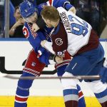 
              New York Rangers defenseman Jacob Trouba (8) and Colorado Avalanche left wing Gabriel Landeskog (92) fight during the second period of an NHL hockey game, Wednesday, Dec. 8, 2021, in New York. (AP Photo/Noah K. Murray)
            
