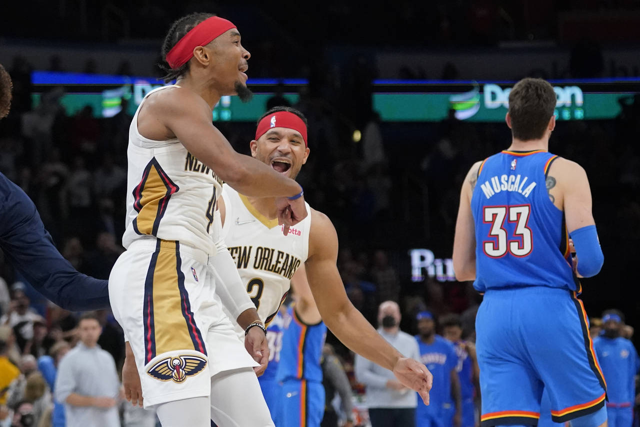 New Orleans Pelicans guard Devonte' Graham (4) celebrates with teammate Josh Hart (3) after hitting...