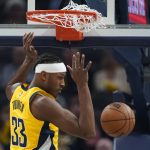 
              Indiana Pacers' Myles Turner (33) dunks during the first half of an NBA basketball game against the Houston Rockets, Thursday, Dec. 23, 2021, in Indianapolis. (AP Photo/Darron Cummings)
            