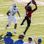 
              Louisville wide receiver Tyler Harrell (8) pulls in a reception in front of Air Force cornerback Eian Castonguay (2) during the first half of the First Responder Bowl NCAA college football game Tuesday, Dec. 28, 2021, in Dallas. (AP Photo/Jeffrey McWhorter)
            