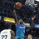 
              Charlotte Hornets' Terry Rozier (3) shoots against Indiana Pacers' Caris LeVert (22) during the first half of an NBA basketball game Wednesday, Dec. 29, 2021, in Indianapolis. (AP Photo/Darron Cummings)
            