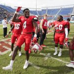 
              Western Kentucky defensive end Niko Cooper (4) dances as he celebrates with teammates after Western Kentucky beat Appalachian State 59-38 in the Boca Bowl NCAA college football game, Saturday, Dec. 18, 2021 in Boca Raton, Fla. (AP Photo/Wilfredo Lee)
            