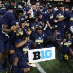 
              Michigan players celebrate on the field after the Big Ten championship NCAA college football game against Iowa, Saturday, Dec. 4, 2021, in Indianapolis. Michigan won 42-3. (AP Photo/Darron Cummings)
            