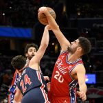 
              Philadelphia 76ers forward Georges Niang (20) battles for the ball against Washington Wizards forward Corey Kispert (24) during the first half of an NBA basketball game, Sunday, Dec. 26, 2021, in Washington. (AP Photo/Nick Wass)
            