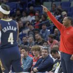 
              New Orleans Pelicans head coach Willie Green points next to New Orleans Pelicans guard Devonte' Graham (4) in the first half of an NBA basketball game against the Dallas Mavericks in New Orleans, Wednesday, Dec. 1, 2021. (AP Photo/Matthew Hinton)
            