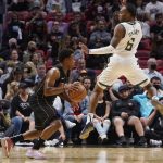 
              Milwaukee Bucks guard Javonte Smart (6) jumps in front of Miami Heat guard Kyle Lowry (7) during the first half of an NBA basketball game, Wednesday, Dec. 8, 2021, in Miami. (AP Photo/Marta Lavandier)
            
