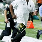 
              Michigan State head coach Mel Tucker runs off tghe field at halftime of the Peach Bowl NCAA college football game between Pittsburgh and Michigan State, Thursday, Dec. 30, 2021, in Atlanta. (AP Photo/John Bazemore)
            