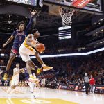 
              Tennessee guard Kennedy Chandler (1) goes for a shot past Arizona guard Justin Kier (5) during an NCAA college basketball game Wednesday, Dec. 22, 2021, in Knoxville, Tenn. (AP Photo/Wade Payne)
            