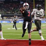 
              Utah quarterback Cameron Rising (7) scores a 2-point conversion against Oregon during the second half of the Pac-12 Conference championship NCAA college football game Friday, Dec. 3, 2021, in Las Vegas. (AP Photo/Chase Stevens)
            