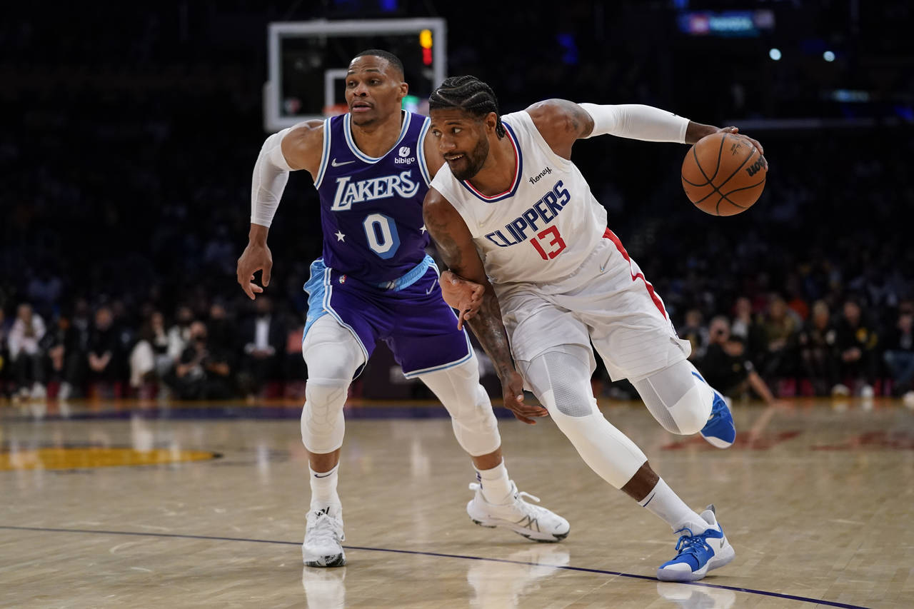 Los Angeles Lakers guard Russell Westbrook (0) defends against Los Angeles Clippers guard Paul Geor...