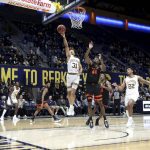 
              California's Jordan Shepherd (31) shoots against Oregon State's Ahmad Rand (44) during the second half of an NCAA college basketball game in Berkeley, Calif., Thursday, Dec. 2, 2021. (AP Photo/Jed Jacobsohn)
            