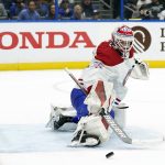
              Montreal Canadiens goaltender Sam Montembeault (35) makes a pad save against the Tampa Bay Lightning during the second period of an NHL hockey game Tuesday, Dec. 28, 2021, in Tampa, Fla. (AP Photo/Chris O'Meara)
            