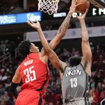 
              Houston Rockets center Christian Wood (35) blocks the shot of Brooklyn Nets guard James Harden during the first half of an NBA basketball game, Wednesday, Dec. 8, 2021, in Houston. (AP Photo/Eric Christian Smith)
            