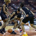 
              Texas guard Marcus Carr, center, fights for a loose ball against Alabama State guard DJ Jackson, right, forward Gerald Liddell, center back, and guard Jayme Mitchell, left, during the first half of an NCAA college basketball game, Wednesday, Dec. 22, 2021, in Austin, Texas. (AP Photo/Michael Thomas)
            