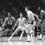 
              FILE - Boston's Sam Jones, left, drives past the Lakers' Jerry West (44) and drives along the baseline towards the basket in the teams' NBA playoff game in Los Angeles on May 2, 1968. At right are Darrall Imhoff of Lakers, who blocked the shot, and Celtics' Bill Russell. Basketball Hall of Famer Jones, the skilled scorer whose 10 NBA titles is second only to teammate Bill Russell, died on Thursday, Dec. 30, 2021, the team said. He was 88. (AP Photo/HF, File)
            