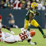 
              Green Bay Packers' Aaron Jones tries to get past Cleveland Browns' Greedy Williams during the first half of an NFL football game Saturday, Dec. 25, 2021, in Green Bay, Wis. (AP Photo/Matt Ludtke)
            