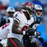 
              Tampa Bay Buccaneers running back Le'Veon Bell runs during the second half of an NFL football game against the Carolina Panthers Sunday, Dec. 26, 2021, in Charlotte, N.C. (AP Photo/Jacob Kupferman)
            