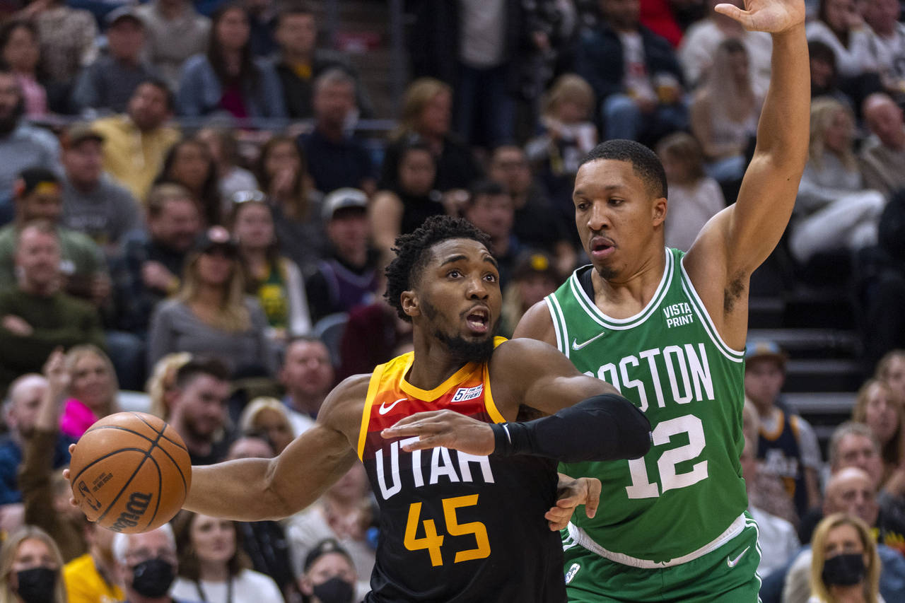 Utah Jazz guard Donovan Mitchell (45) drives against Boston Celtics forward Grant Williams (12) dur...
