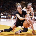 
              Stanford guard Lexie Hull, left, battles for the ball with Tennessee guard Sara Puckett, front right, during the first half of an NCAA college basketball game Saturday, Dec. 18, 2021, in Knoxville, TN. (AP Photo/Wade Payne)
            