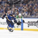 
              St. Louis Blues defenseman Colton Parayko (55) races to the puck against Dallas Stars left wing Michael Raffl (18) during the first period of an NHL hockey game on Friday, Dec. 17, 2021, in St. Louis. (AP Photo/Arnold J. Ward)
            