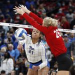 
              Pittsburgh's Serena Gray, left, spikes the ball past Nebraska's Lauren Stivrins during a semifinal of the NCAA women's college volleyball tournament Friday, Dec. 17, 2021, in Columbus, Ohio. (AP Photo/Paul Vernon)
            