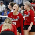 
              Nebraska's Lauren Stivrins, center, celebrates with teammates Ally Batenhorst, left, and Nicklin Hames following victory in a semifinal of the NCAA women's college volleyball tournament over Pittsburgh Friday, Dec. 17, 2021, in Columbus, Ohio. (AP Photo/Paul Vernon)
            
