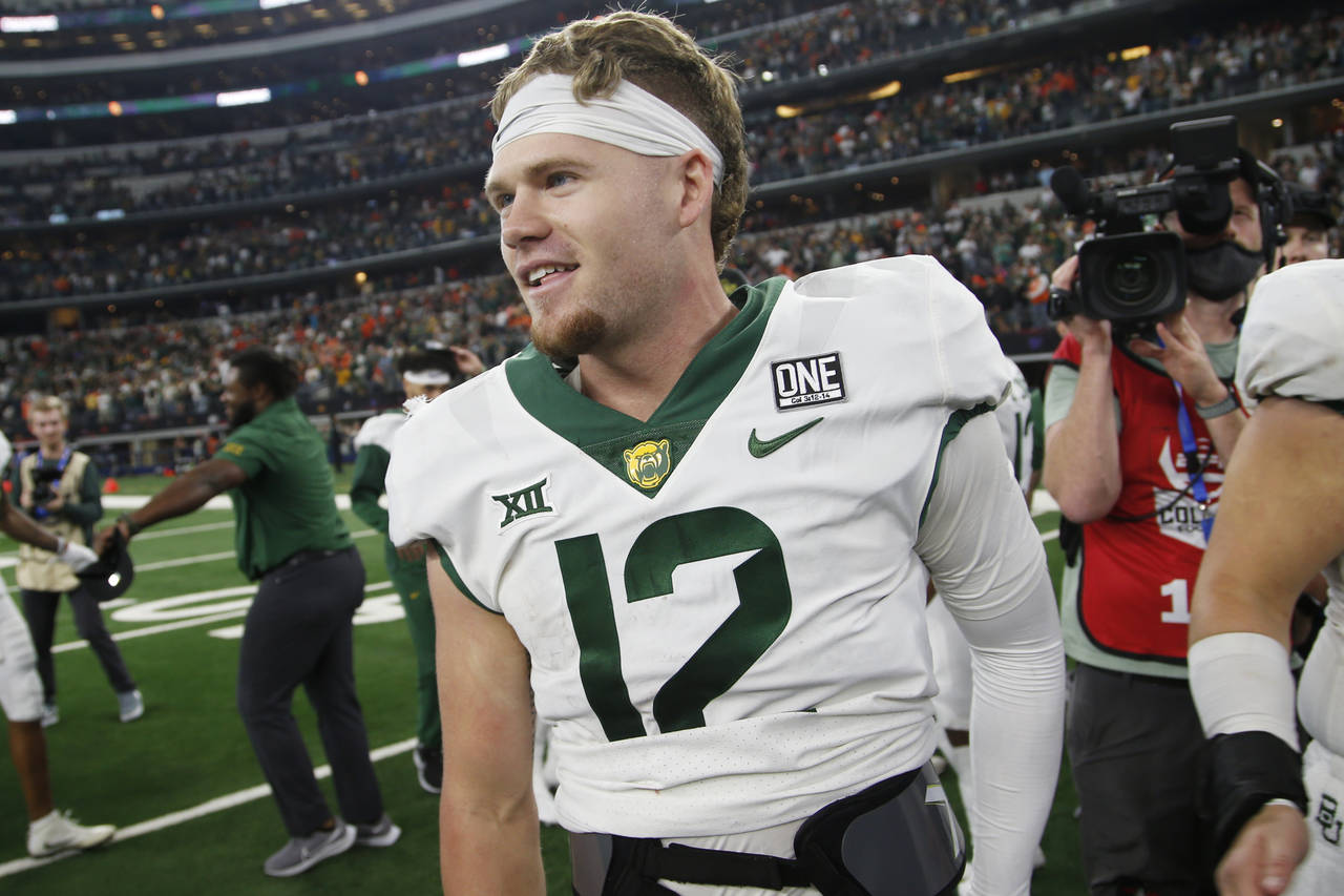 Baylor quarterback Blake Shapen (12) celebrates on the field after they defeated Oklahoma State in ...