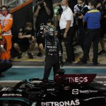 
              Mercedes driver Lewis Hamilton of Britain waves after winning second position for the Formula One Abu Dhabi Grand Prix in Abu Dhabi, United Arab Emirates, Saturday Dec 11, 2021. (AP Photo/Hassan Ammar)
            
