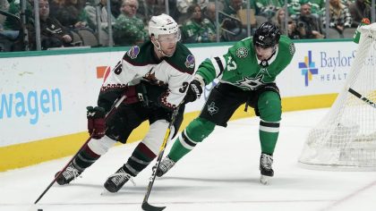 Arizona Coyotes right wing Christian Fischer (36) looks to make a pass as Dallas Stars right wing A...