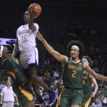 
              Alcorn State guard Dominic Brewton (15) is fouled by Baylor forward Flo Thamba, left, while driving past Kendall Brown, right, in the first half of an NCAA college basketball game, Monday, Dec. 20, 2021, in Waco, Texas. (AP Photo/Rod Aydelotte)
            