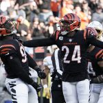 
              Cincinnati Bengals' Cameron Sample (96) and Vonn Bell (24) celebrate a sack of Los Angeles Chargers' Justin Herbert during the second half of an NFL football game, Sunday, Dec. 5, 2021, in Cincinnati. (AP Photo/Jeff Dean)
            
