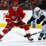 
              Detroit Red Wings right wing Lucas Raymond (23) drives toward the goal against Seattle Kraken center Colin Blackwell (43) during the first period of an NHL hockey game Wednesday, Dec. 1, 2021, in Detroit. (AP Photo/Duane Burleson)
            
