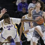 
              LSU forward Darius Days (4) attempts to steal the ball from Lipscomb guard KJ Johnson (0) during the first half of an NCAA college basketball game in Baton Rouge, La., Wednesday, Dec. 22, 2021. (AP Photo/Matthew Hinton)
            