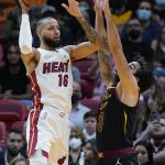 
              Miami Heat forward Caleb Martin (16) takes a shot against Cleveland Cavaliers guard Ricky Rubio (3) during the first half of an NBA basketball game, Wednesday, Dec. 1, 2021, in Miami. (AP Photo/Wilfredo Lee)
            