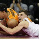 
              Kansas' Christian Braun, right, and UTEP's Tydus Verhoeven vie for the ball during the first half of an NCAA college basketball game Tuesday, Dec. 7, 2021, in Kansas City, Mo. (AP Photo/Charlie Riedel)
            